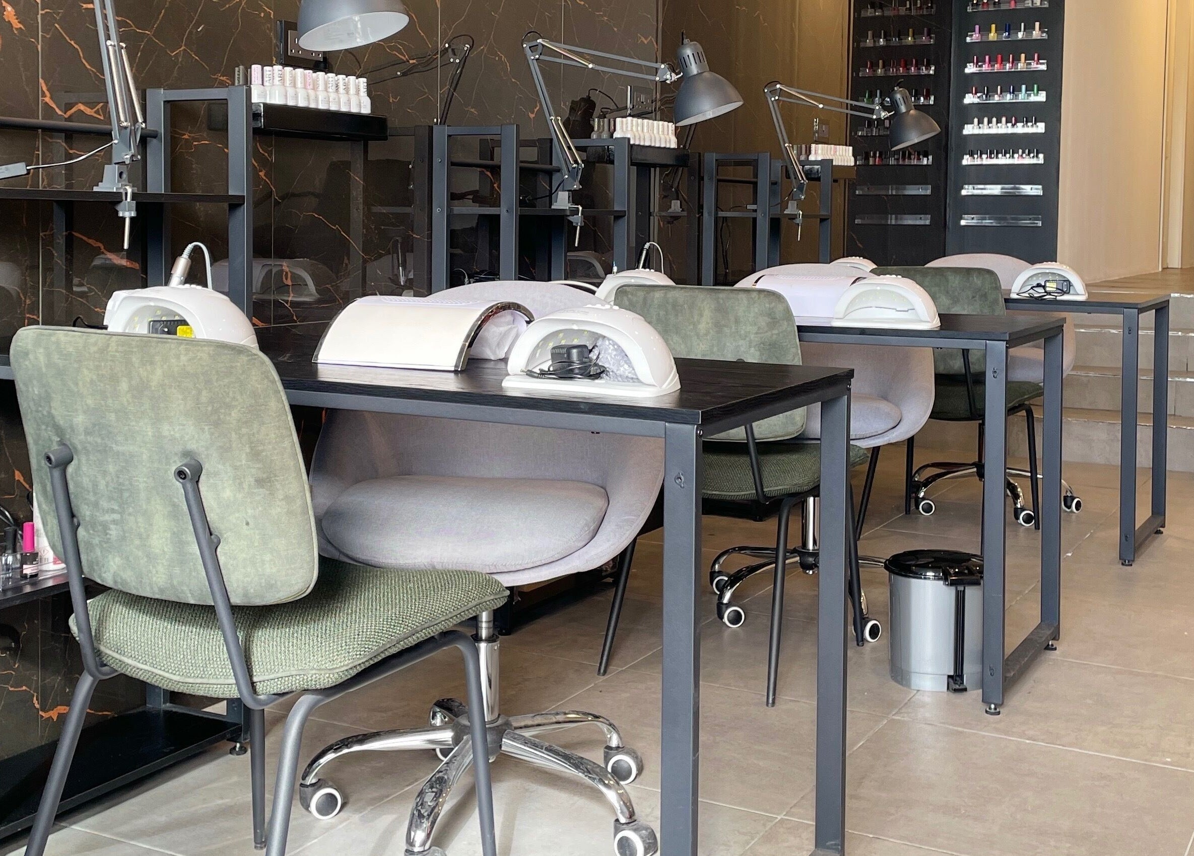 Modern nail salon setup at Diva Beauty Lounge, Tas-sliema, MT, showcasing manicure stations.
