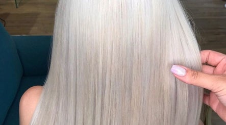 Platinum blonde hair styled at Lily Hair Studio, Barcelona, Catalunya, ES, showcasing smooth, shiny finish.