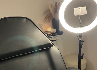 Nova Luxe treatment room with chair and ring light in Pudsey, England, GB, offering relaxation and style.