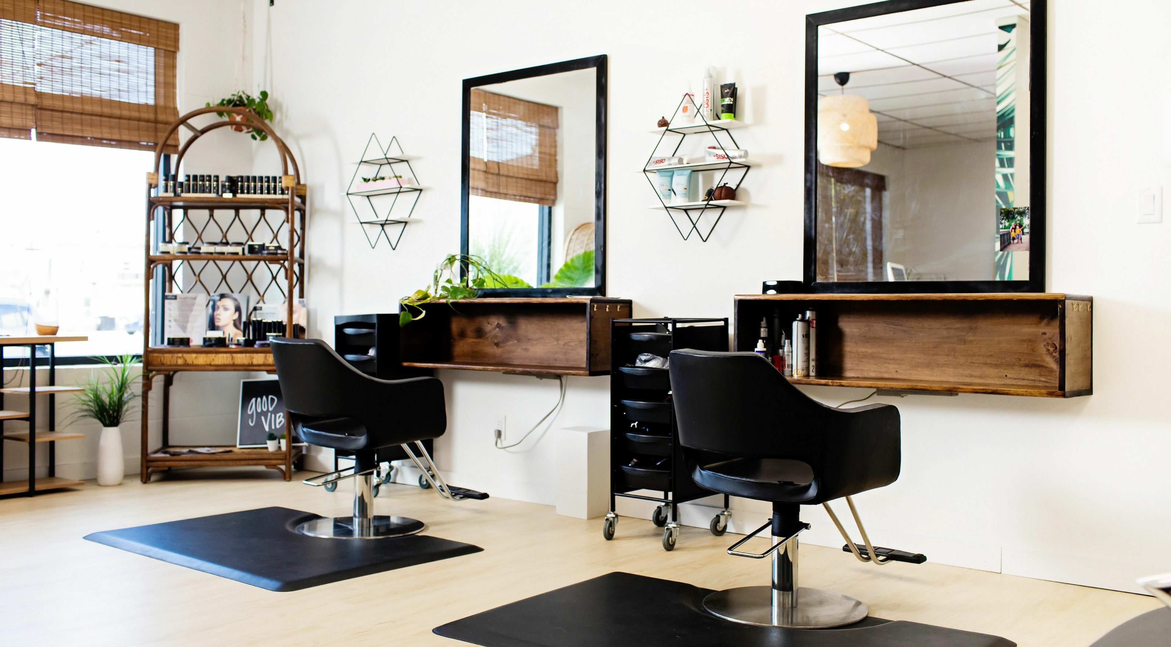 Modern salon chairs at The Polished Parlour, Essex, Ontario, CA, with stylish decor and warm lighting.