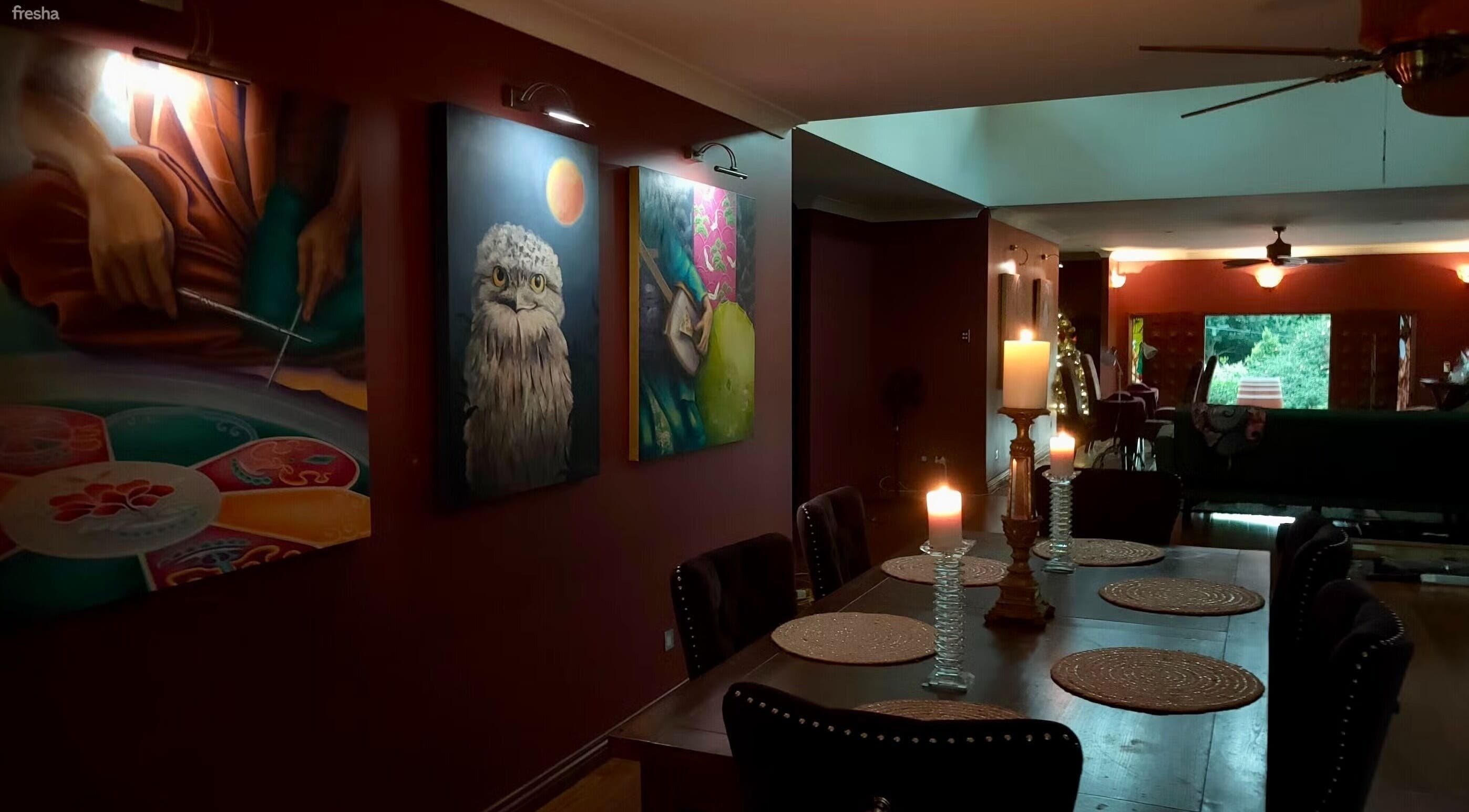 Elegant dining area with artistic wall decor at Blissage Day Spa Sanctuary, Tamborine Mountain, Queensland, AU.