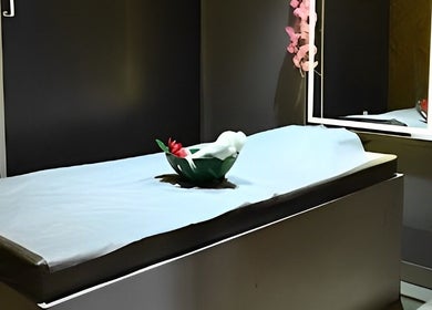 Relaxing spa treatment room at Candid Beauty Salon and Spa, Bengaluru, Karnataka, IN with soft lighting.