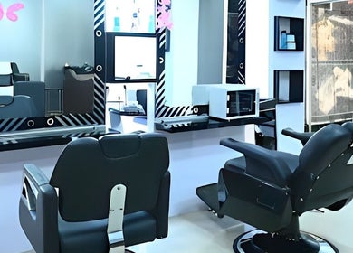 Modern salon chairs at Candid Beauty Salon and Spa, Bengaluru, Karnataka, IN, showcasing sleek decor.