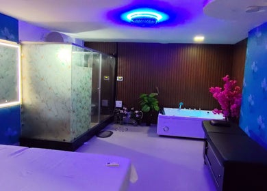 Luxurious spa room at Candid Beauty Salon and Spa, Bengaluru, Karnataka, IN with ambient lighting and decor.