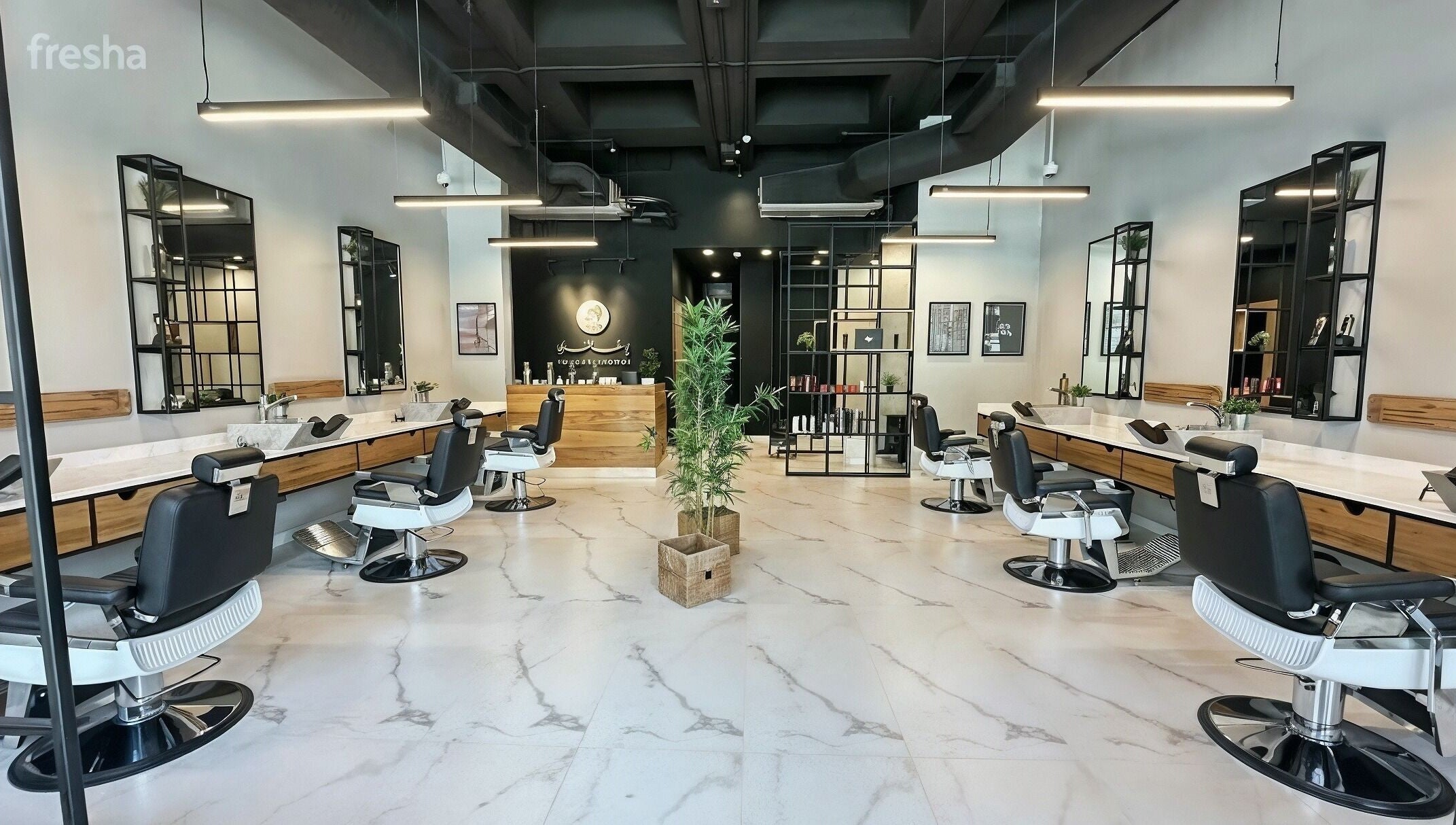 Modern salon interior at Yousef Afandi - Suleymaniya in Riyadh, Riyadh Province, SA with stylish chairs and decor.