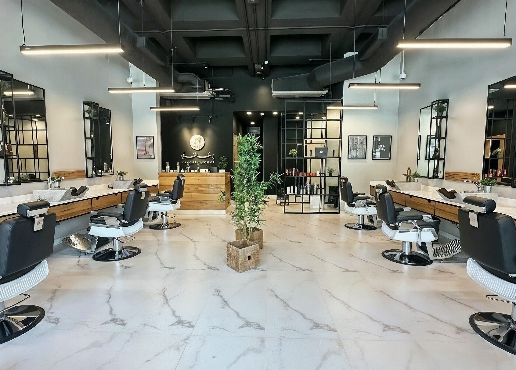 Modern salon interior at Yousef Afandi - Suleymaniya in Riyadh, Riyadh Province, SA with stylish chairs and decor.