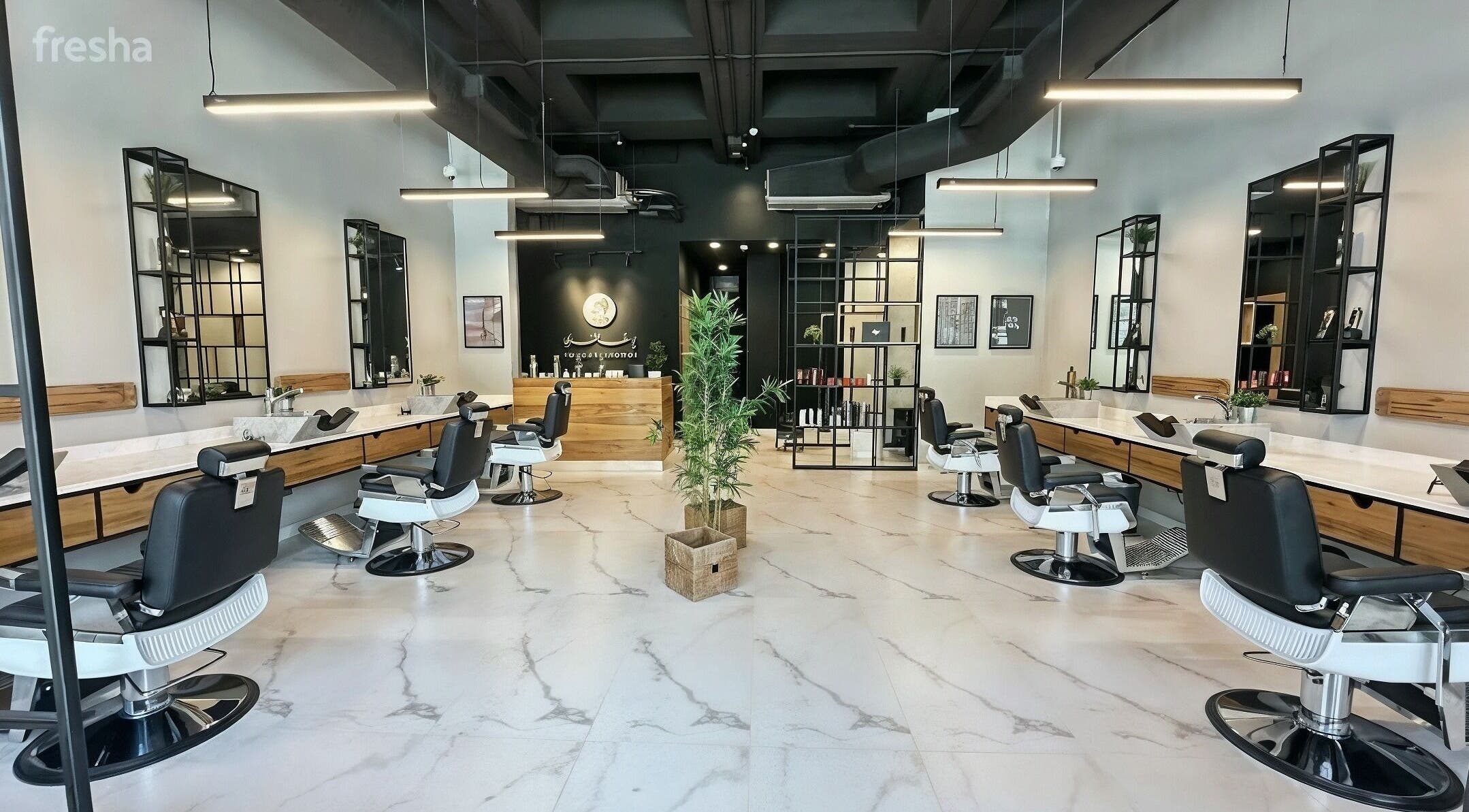 Modern salon interior at Yousef Afandi - Suleymaniya in Riyadh, Riyadh Province, SA with stylish chairs and decor.