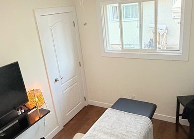 Relaxing massage room in Breath Ease Massage Studio, Edmonton, Alberta, CA, with a comfortable massage table.