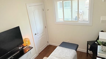 Relaxing massage room in Breath Ease Massage Studio, Edmonton, Alberta, CA, with a comfortable massage table.