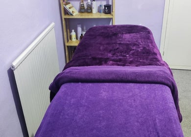 Calming massage room at Lavender Holistic Therapy in Skipton, England, GB, featuring plush purple decor.