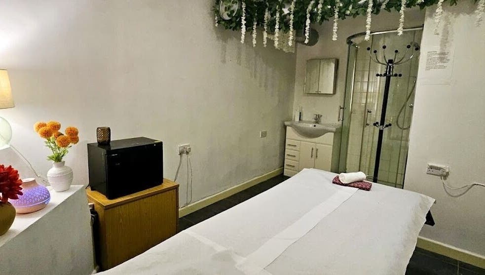 Tranquil spa room at Mong Kon Thai Massage & Spa London, located in London, England, GB. Features cozy massage table.