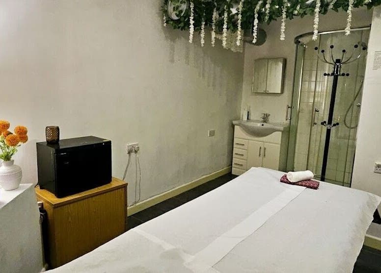 Tranquil spa room at Mong Kon Thai Massage & Spa London, located in London, England, GB. Features cozy massage table.