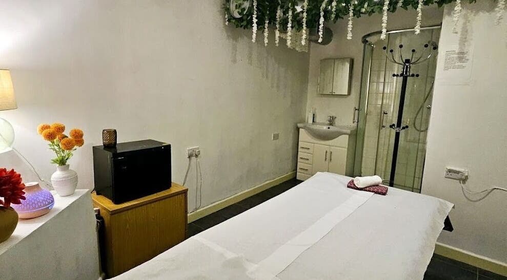 Tranquil spa room at Mong Kon Thai Massage & Spa London, located in London, England, GB. Features cozy massage table.