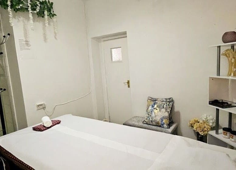 Cozy massage room at Mong Kon Thai Massage & Spa London, London, England, GB with elegant decor and calming ambiance.