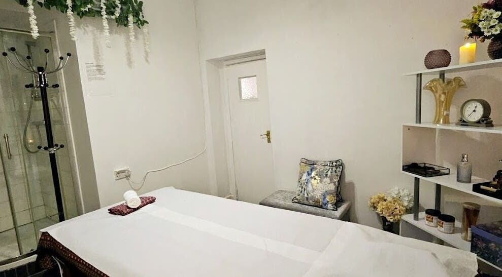 Cozy massage room at Mong Kon Thai Massage & Spa London, London, England, GB with elegant decor and calming ambiance.