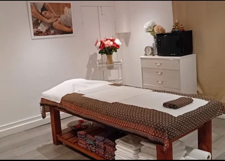 Relaxing massage room at Mong Kon Thai Massage & Spa London, London, England, GB with massage table and decor.