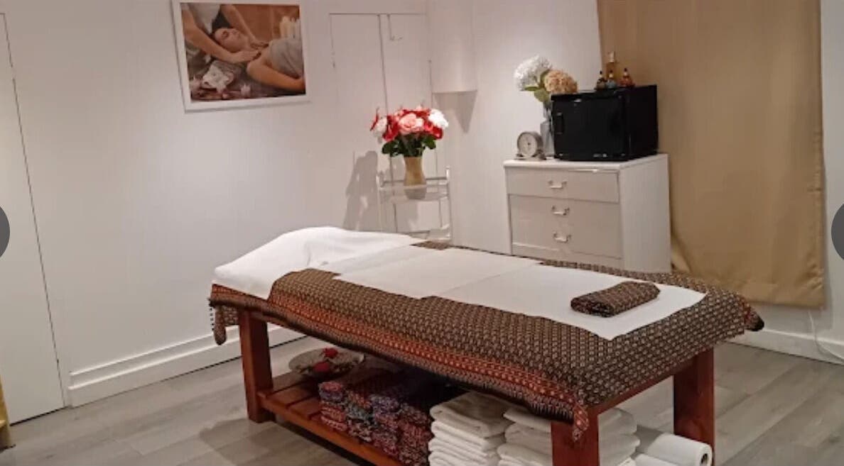 Relaxing massage room at Mong Kon Thai Massage & Spa London, London, England, GB with massage table and decor.