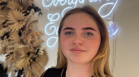 Freshly groomed brows at Browsbygraciee, Watford, England, GB with elegant decor in the background.