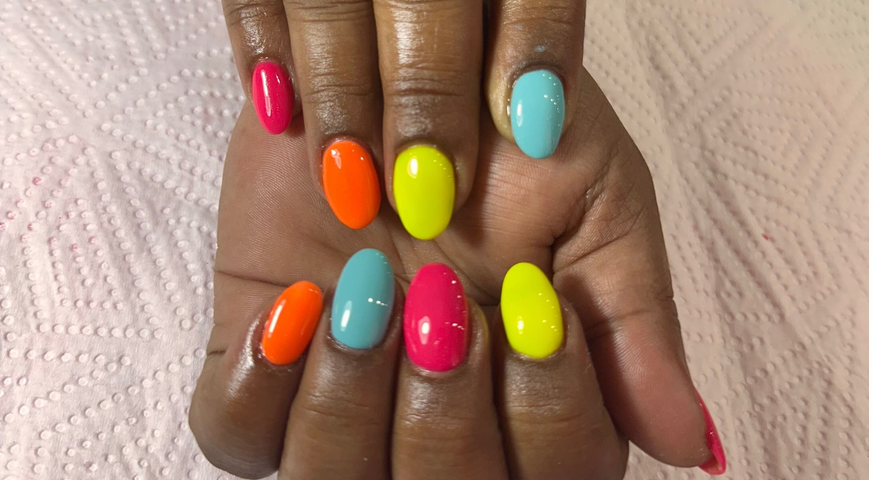Colorful gel nails at Koa Beauty Bar, Cape Town, Western Cape, ZA showcasing vibrant nail artistry.