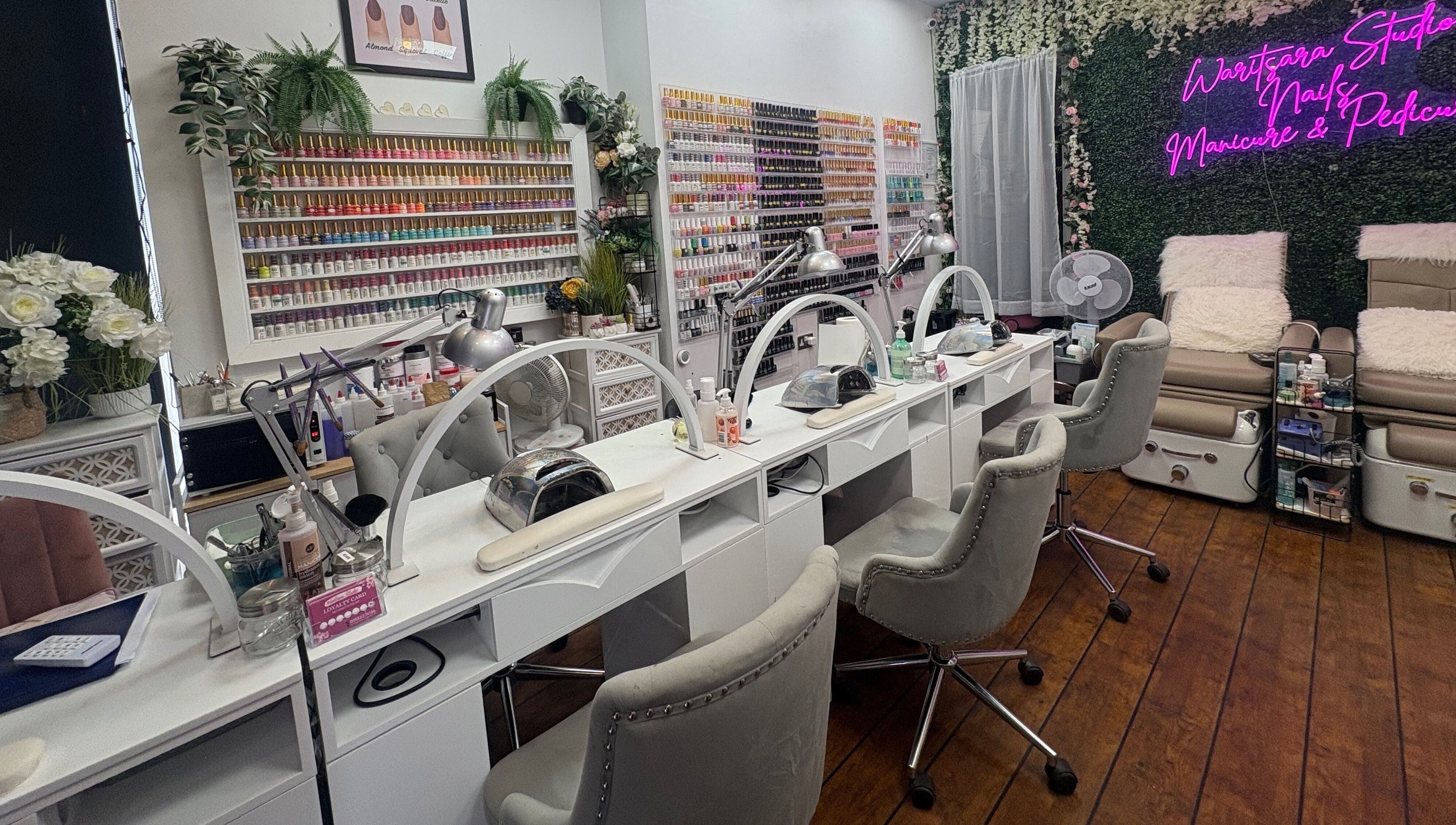 Interior of Waritsara Studio Nails in Oundle, featuring manicuring stations and elegant decor in Oundle, England, GB.