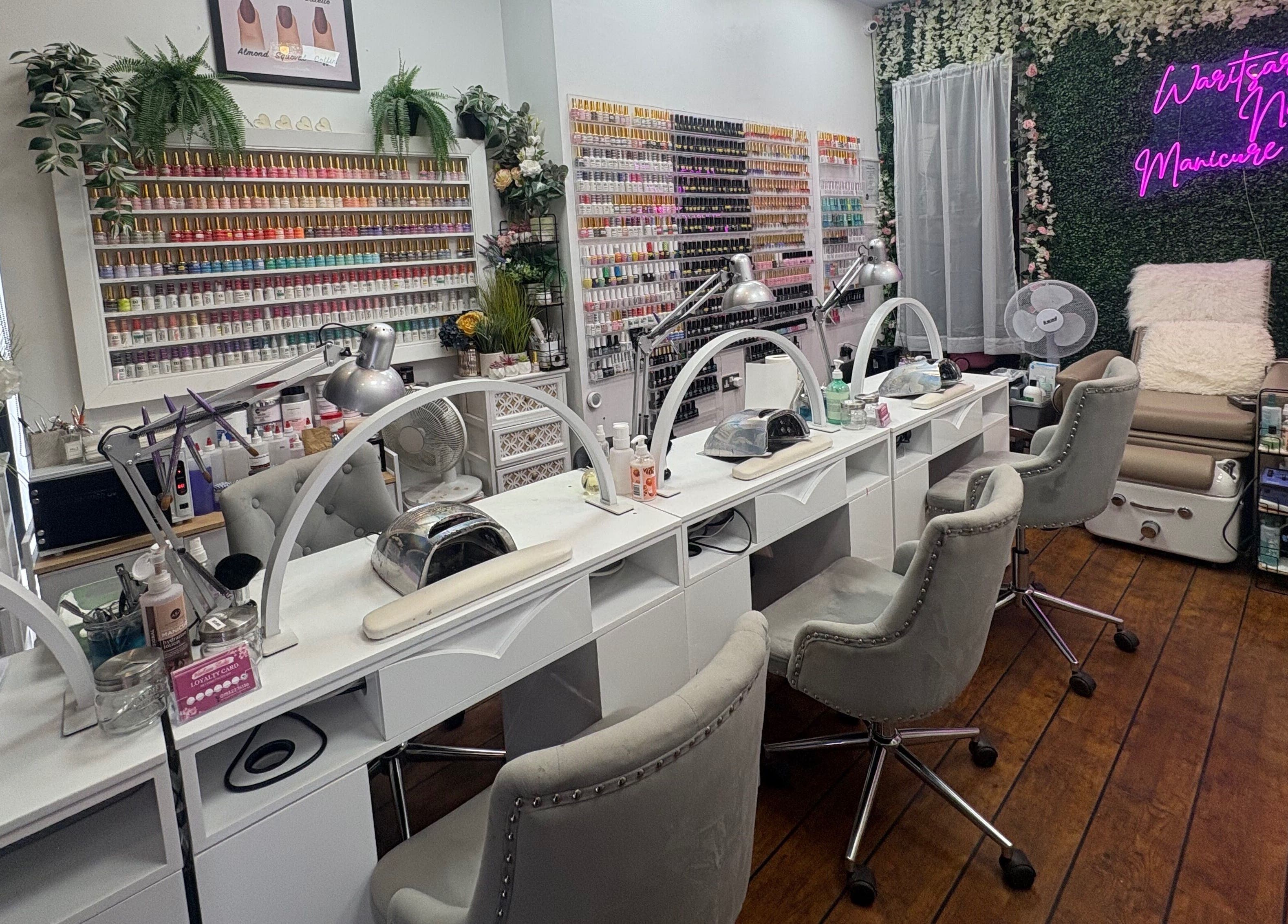Interior of Waritsara Studio Nails in Oundle, featuring manicuring stations and elegant decor in Oundle, England, GB.