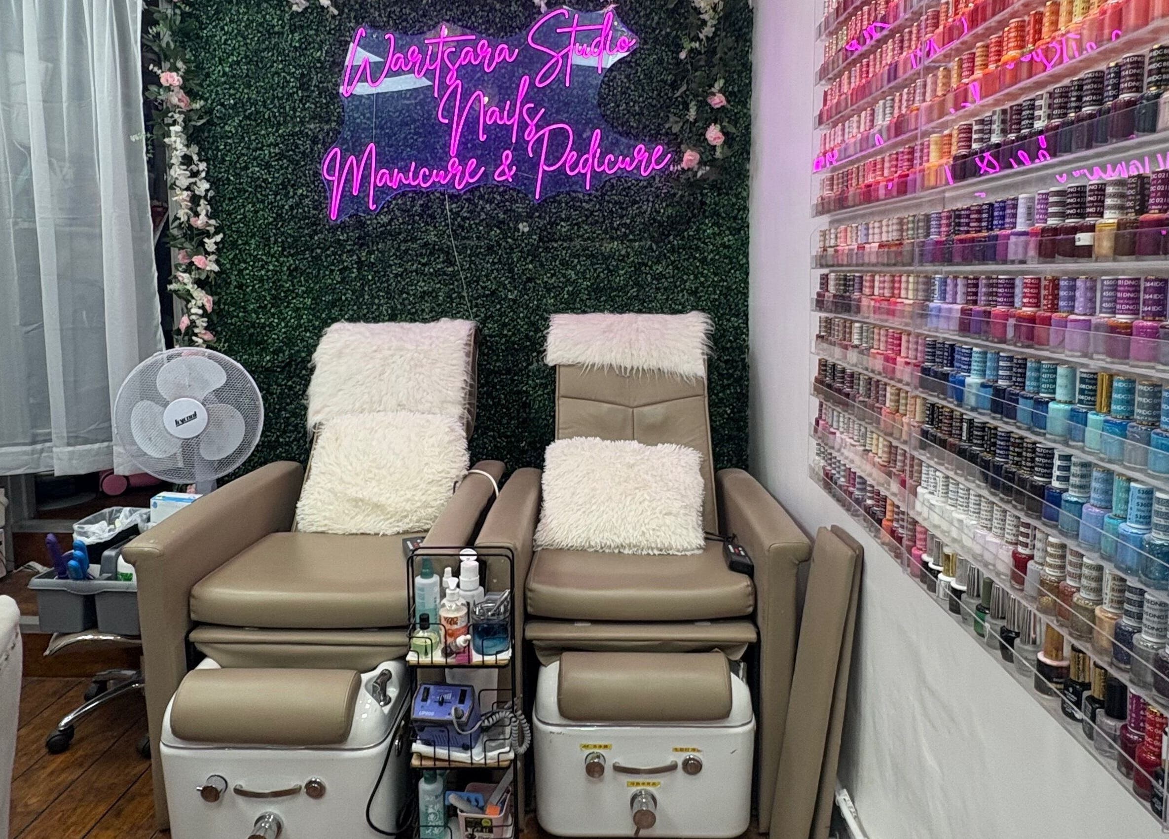 Luxurious nail spa chairs and vibrant polish display at Waritsara Studio Nails in Oundle, England, GB.