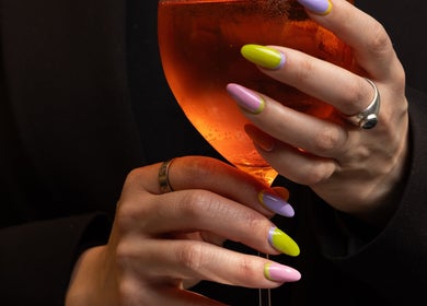 Vibrant manicure at Bo Nail Bar, Ciudad De México, MX, holding a chic drink.