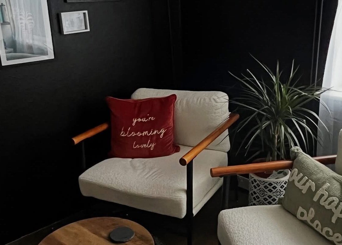 Inviting seating area at Stephanie Duval Hair at Eselle Collective, Bristol, England, GB with plush cushions and decor.