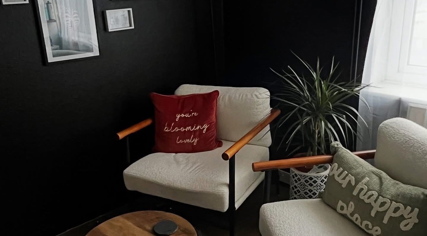 Inviting seating area at Stephanie Duval Hair at Eselle Collective, Bristol, England, GB with plush cushions and decor.