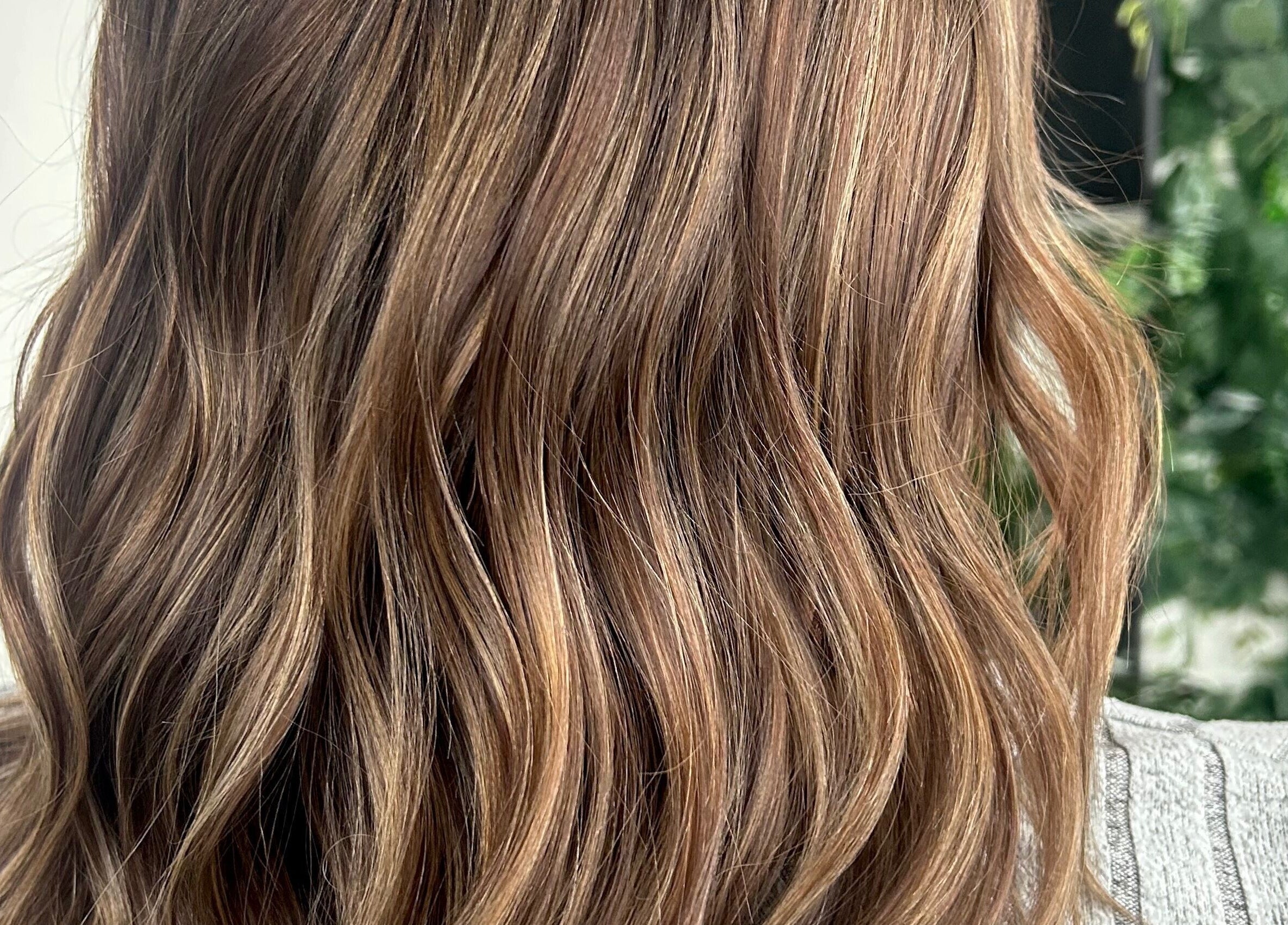 Glossy brown waves styled at Stephanie Duval Hair at Eselle Collective in Bristol, England, GB.