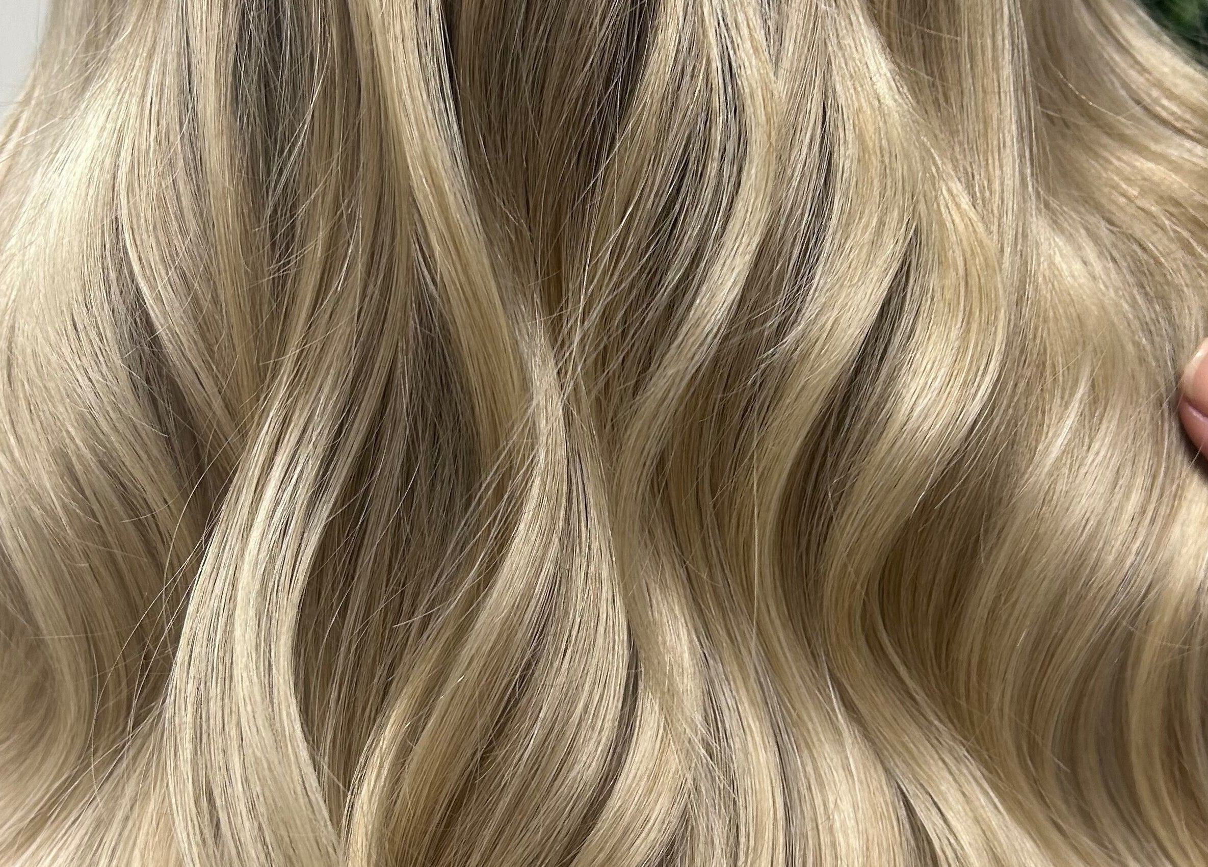 Flowing blonde hair styled at Stephanie Duval Hair at Eselle Collective, Bristol, England, GB.