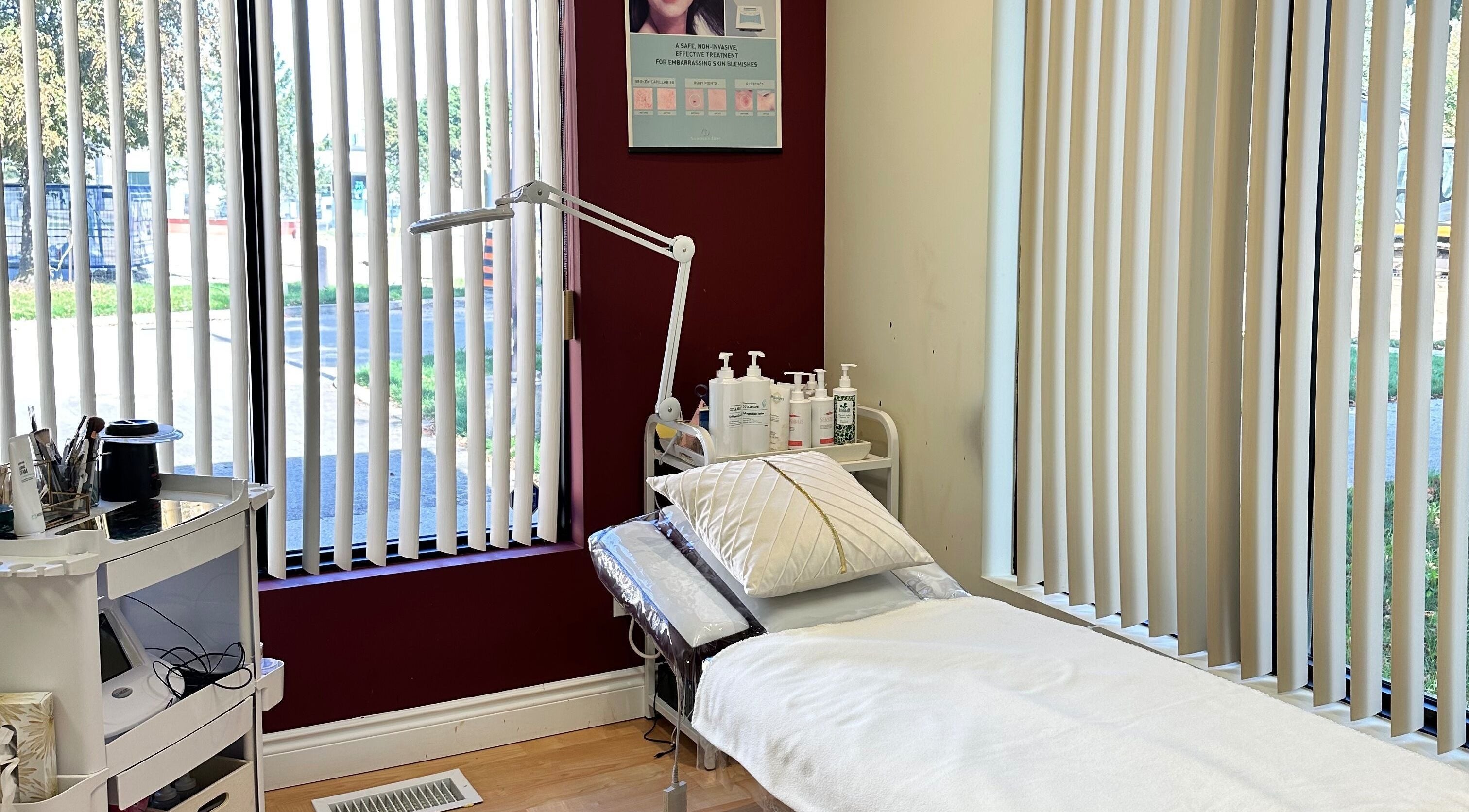 Serene treatment room at Escape Salon Day and Spa, Kitchener, Ontario, CA with a cozy bed and natural light.