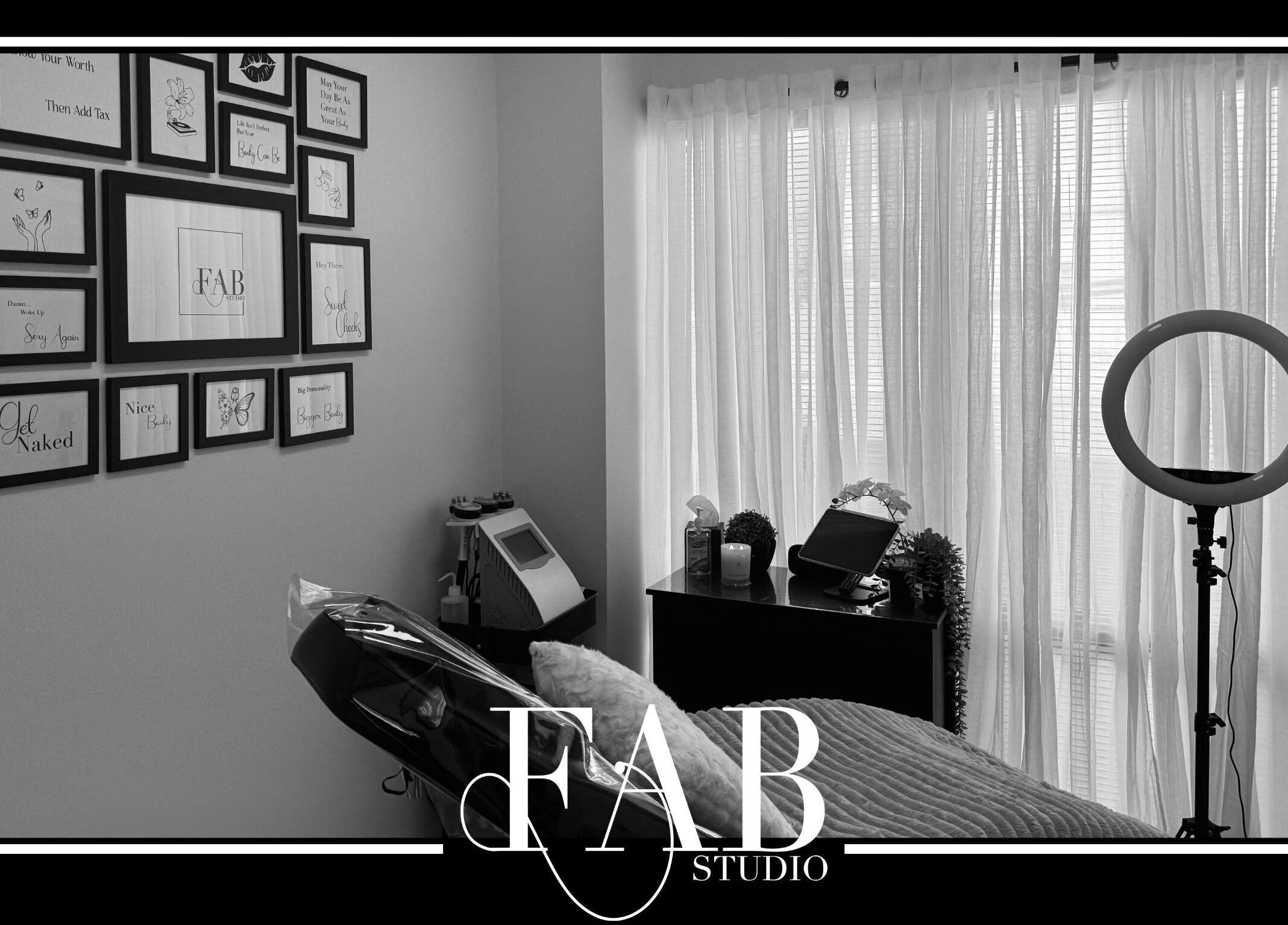 Relaxing treatment room at FAB Studio, Neerabup, Western Australia, AU, featuring elegant decor and soft lighting.