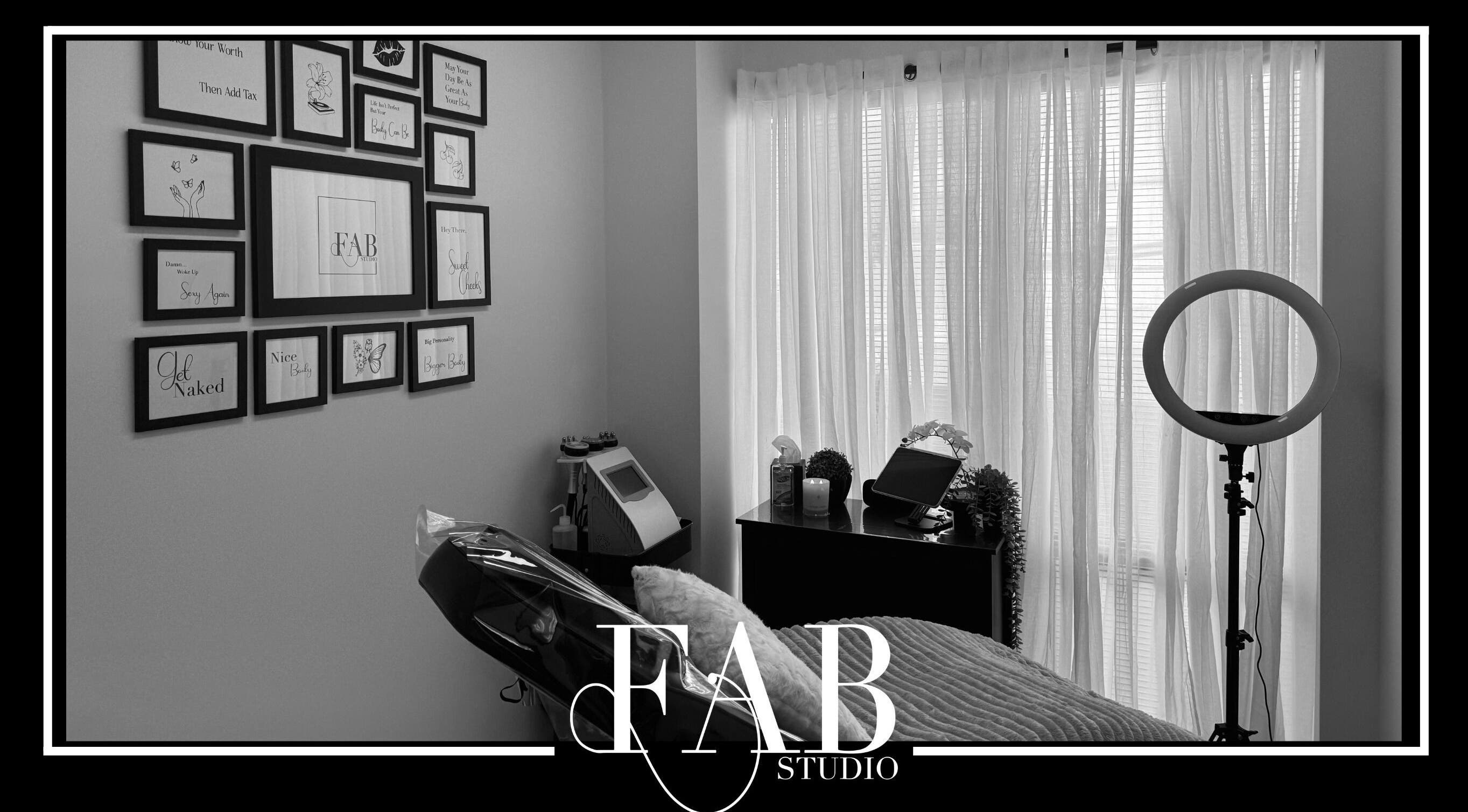 Relaxing treatment room at FAB Studio, Neerabup, Western Australia, AU, featuring elegant decor and soft lighting.