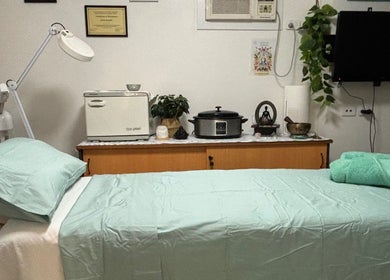 Relaxing spa room in Mind & Body Wellness Solutions, Narangba, Queensland, AU with massage bed and calming decor.