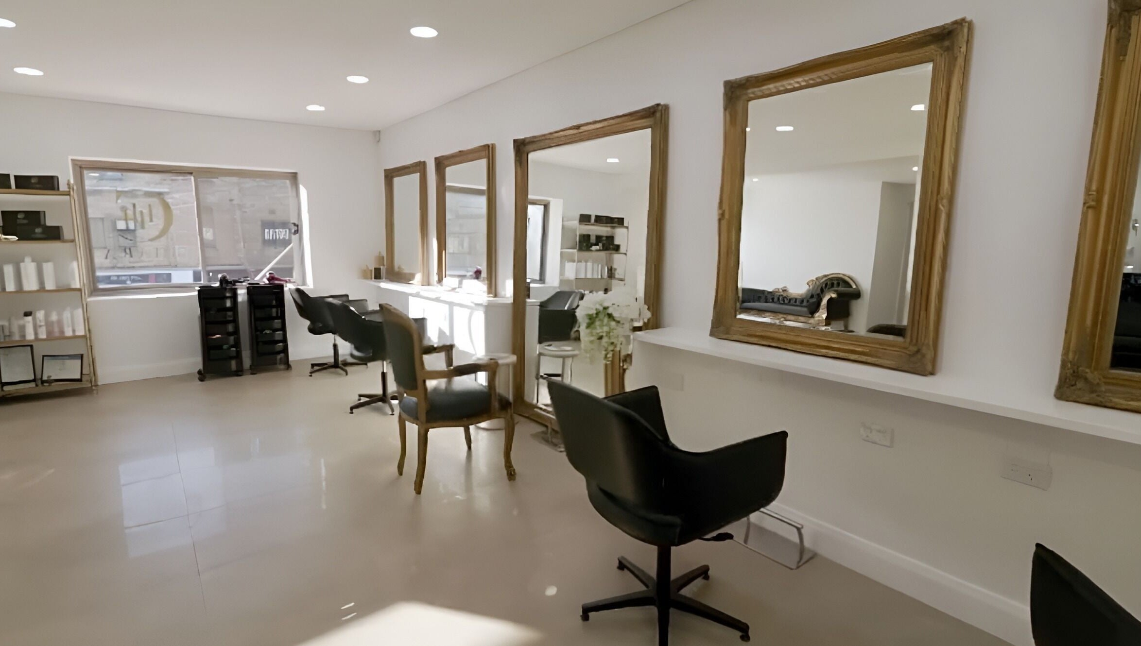 Chic salon interior at Chiara House of Hair, Warrawong, NSW, AU with elegant mirrors and styling chairs.