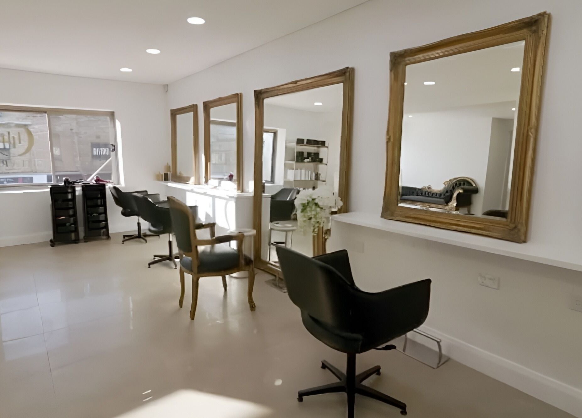 Chic salon interior at Chiara House of Hair, Warrawong, NSW, AU with elegant mirrors and styling chairs.