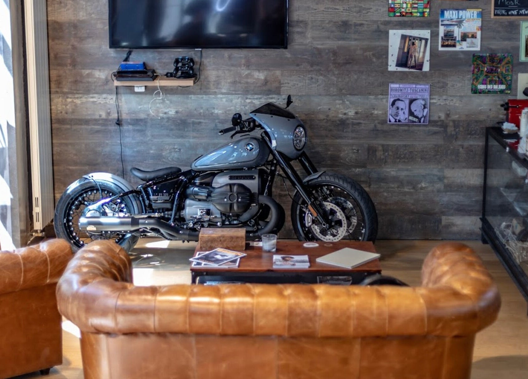 Stylish motorcycle in leather lounge at Men's Club for Good Times, Genève, Genève, CH.