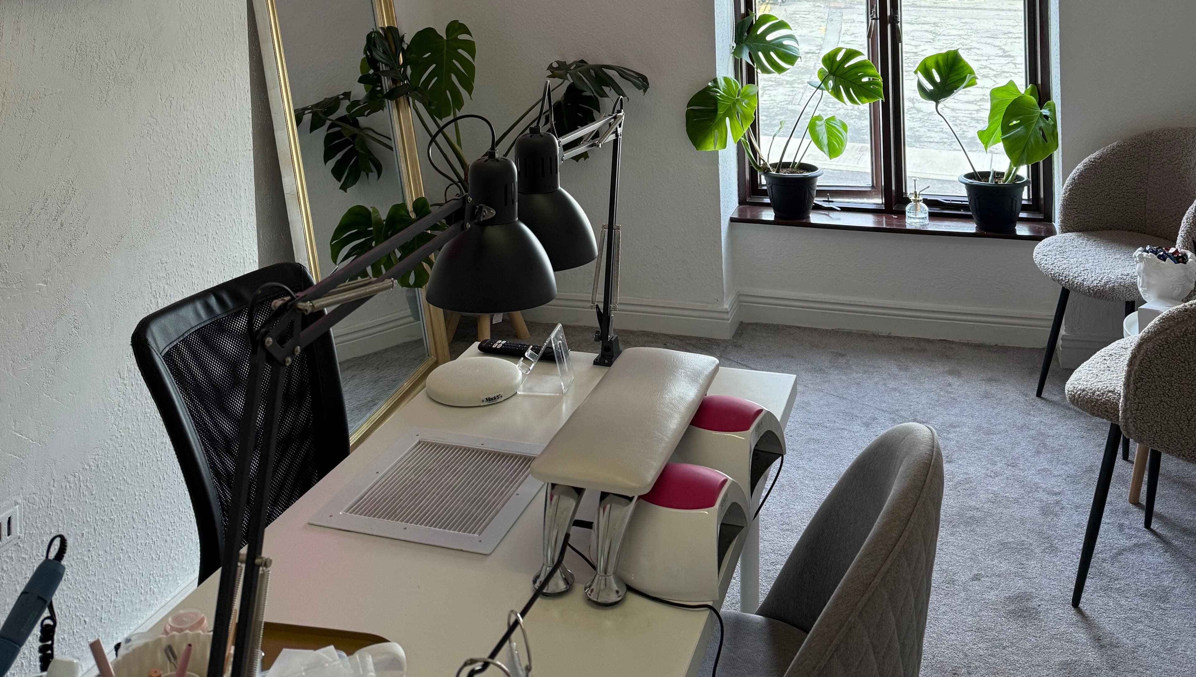 Calm, modern interior of Kristina.NailStudio at Naas, County Kildare, IE with plants and manicure station.