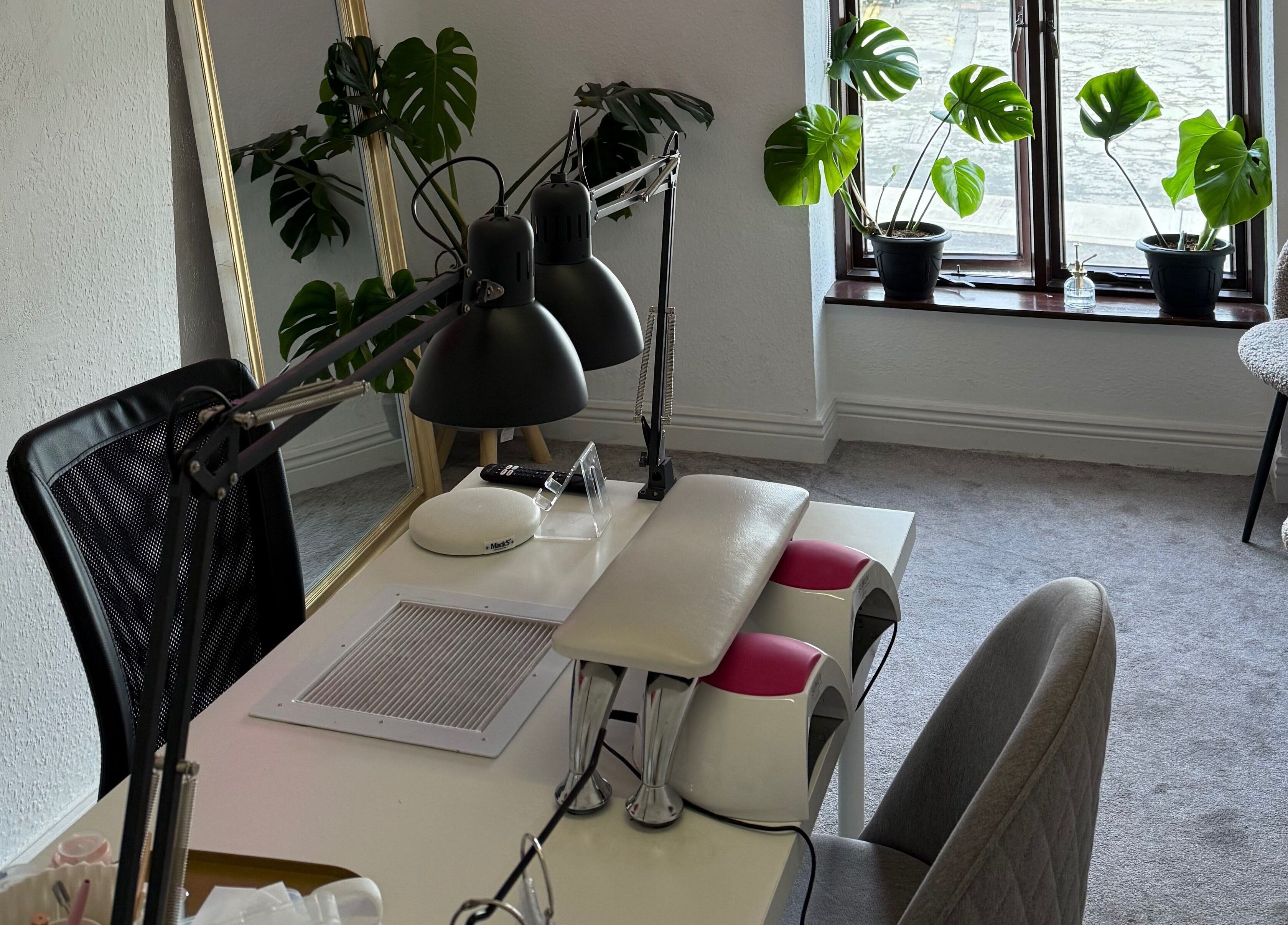Calm, modern interior of Kristina.NailStudio at Naas, County Kildare, IE with plants and manicure station.