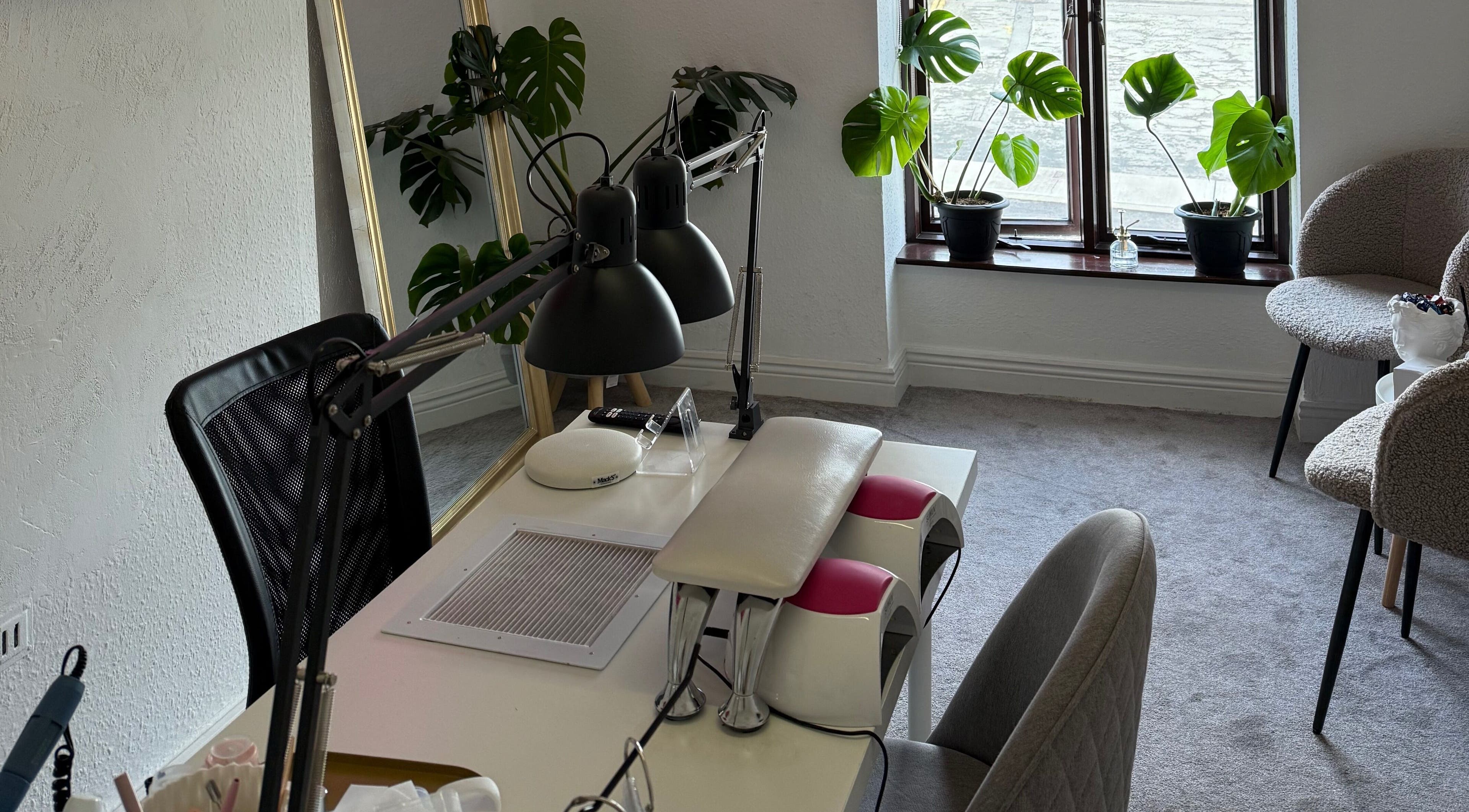 Calm, modern interior of Kristina.NailStudio at Naas, County Kildare, IE with plants and manicure station.