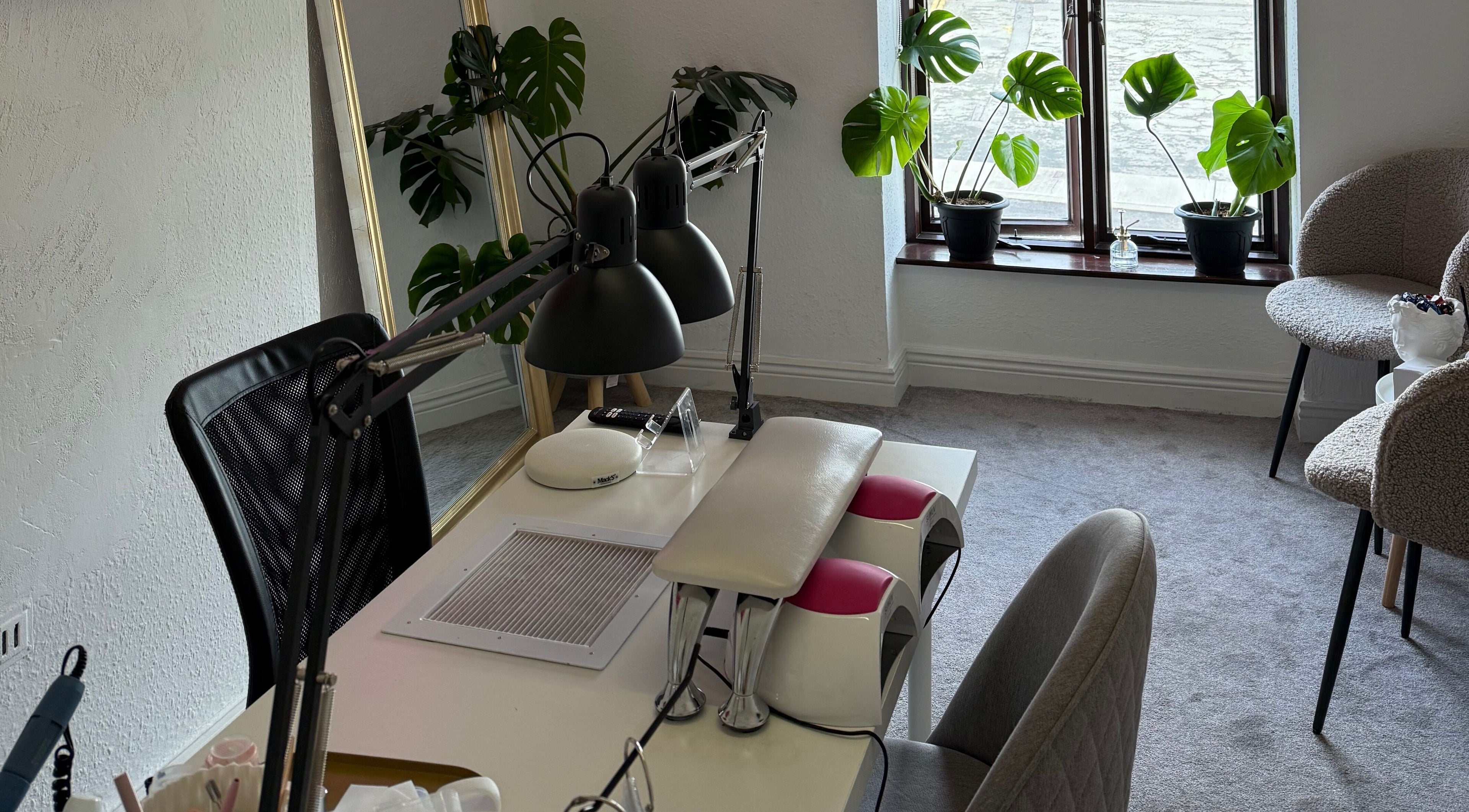 Calm, modern interior of Kristina.NailStudio at Naas, County Kildare, IE with plants and manicure station.
