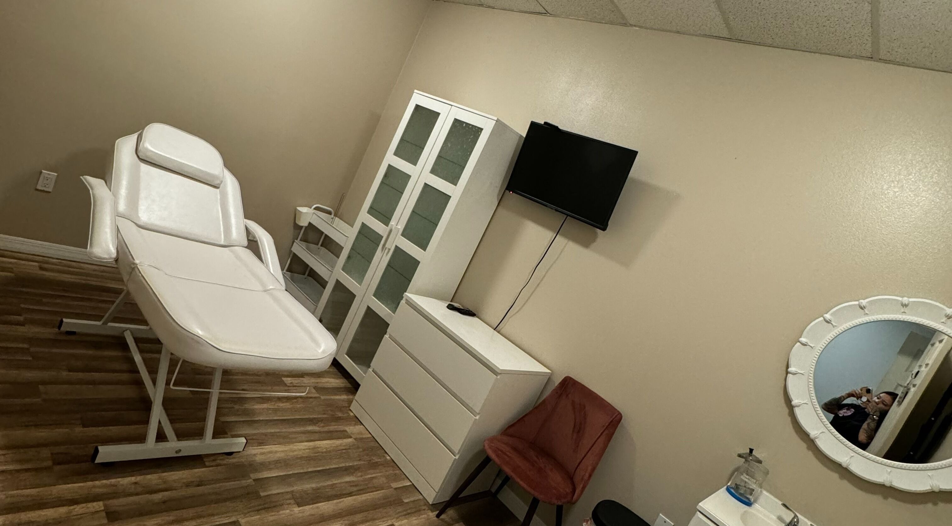 Elegant Esthetics' tranquil treatment room in Debary, Florida, US, featuring a comfortable white massage table.