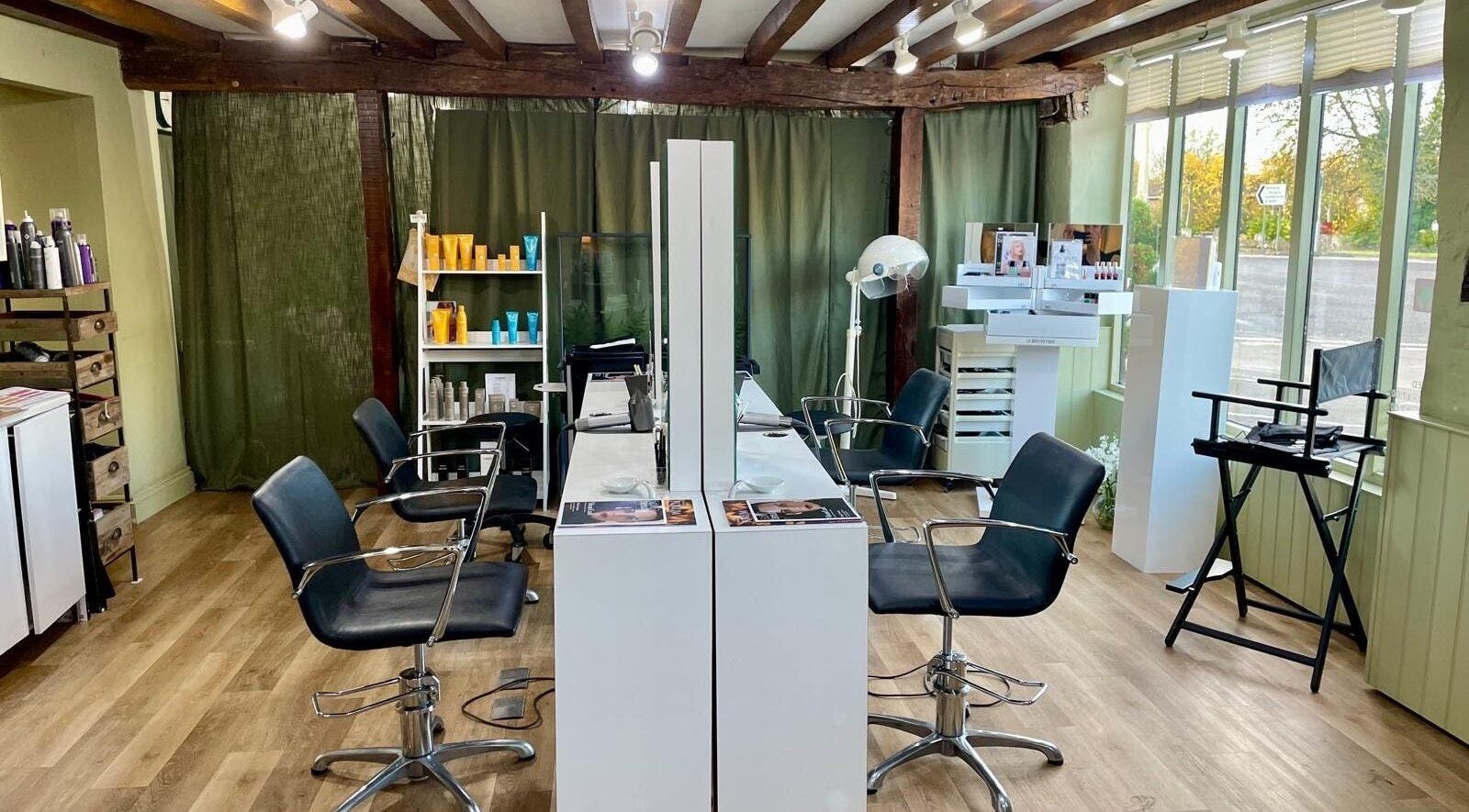 Interior of HUB Beauty By Hayley, Stockbridge, England, GB showing stylish salon chairs and beauty products.
