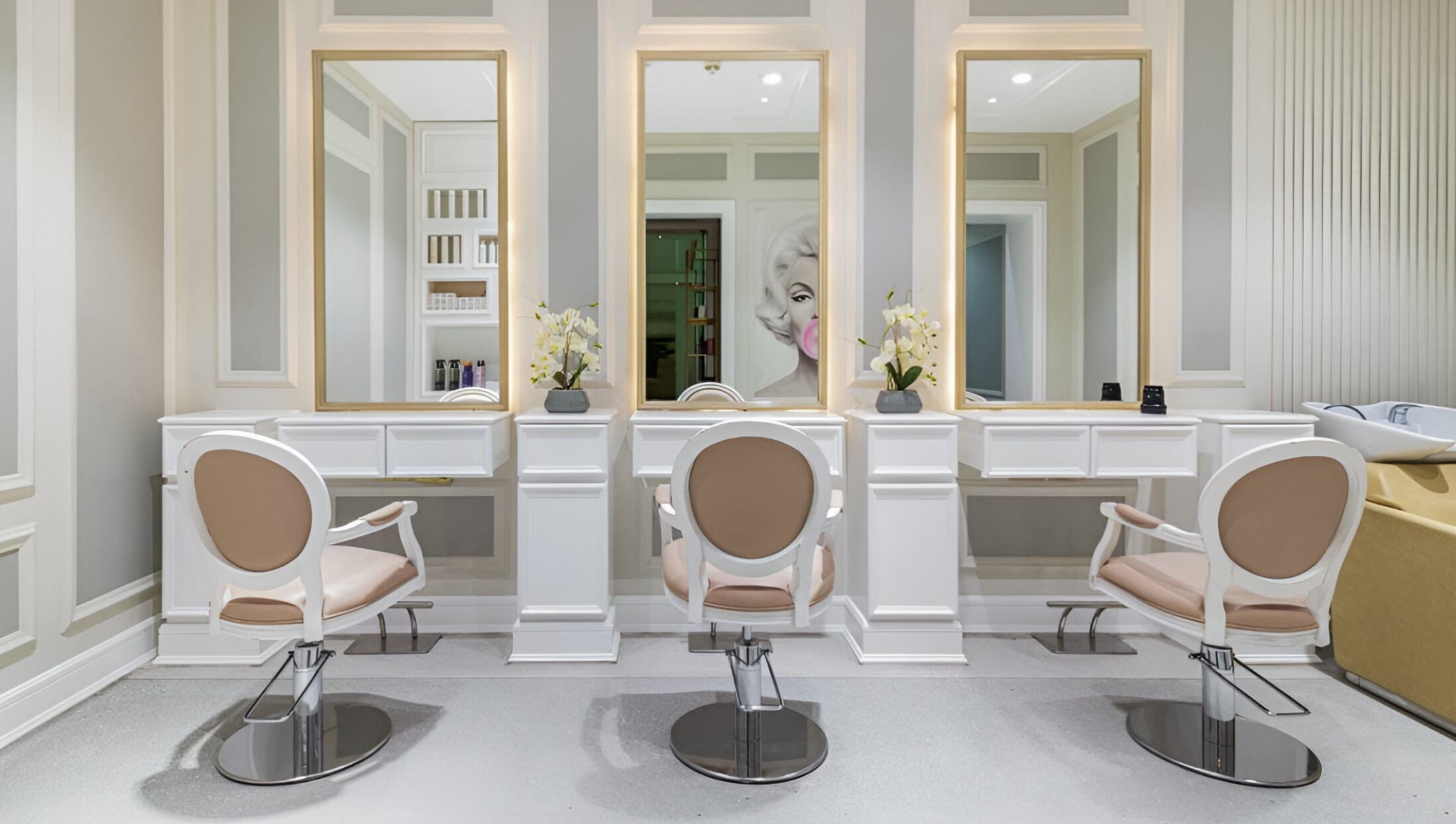 Luxurious interior of Zaki Gents Salon - Anantara in Dubai, Dubai, AE, featuring stylish salon chairs and mirrors.