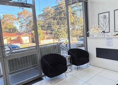 Elegant waiting area of Rina’s laser and beauty clinic, Merrylands West, New South Wales, AU, with modern decor.