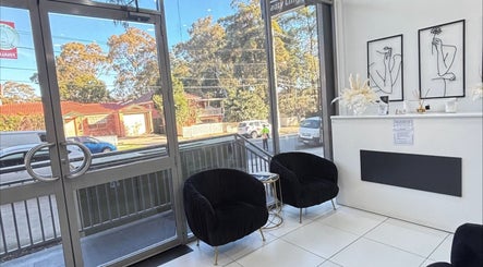 Elegant waiting area of Rina’s laser and beauty clinic, Merrylands West, New South Wales, AU, with modern decor.
