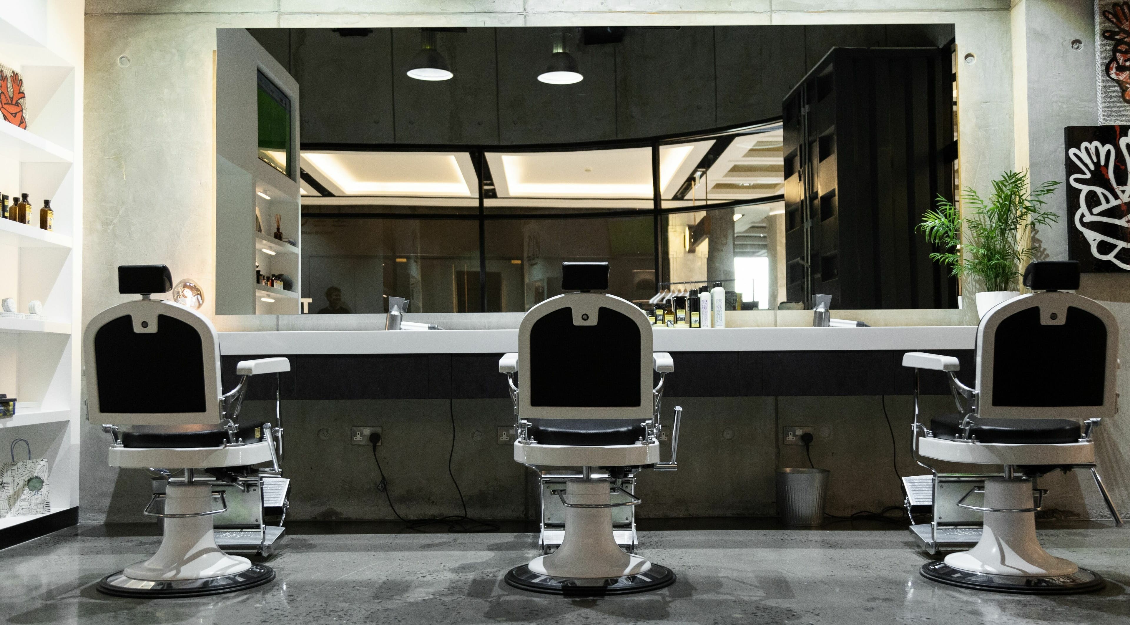 Elegant grooming chairs at 011 Italian Grooming DIFC, Dubai, Dubai, AE, offering premium barber services.