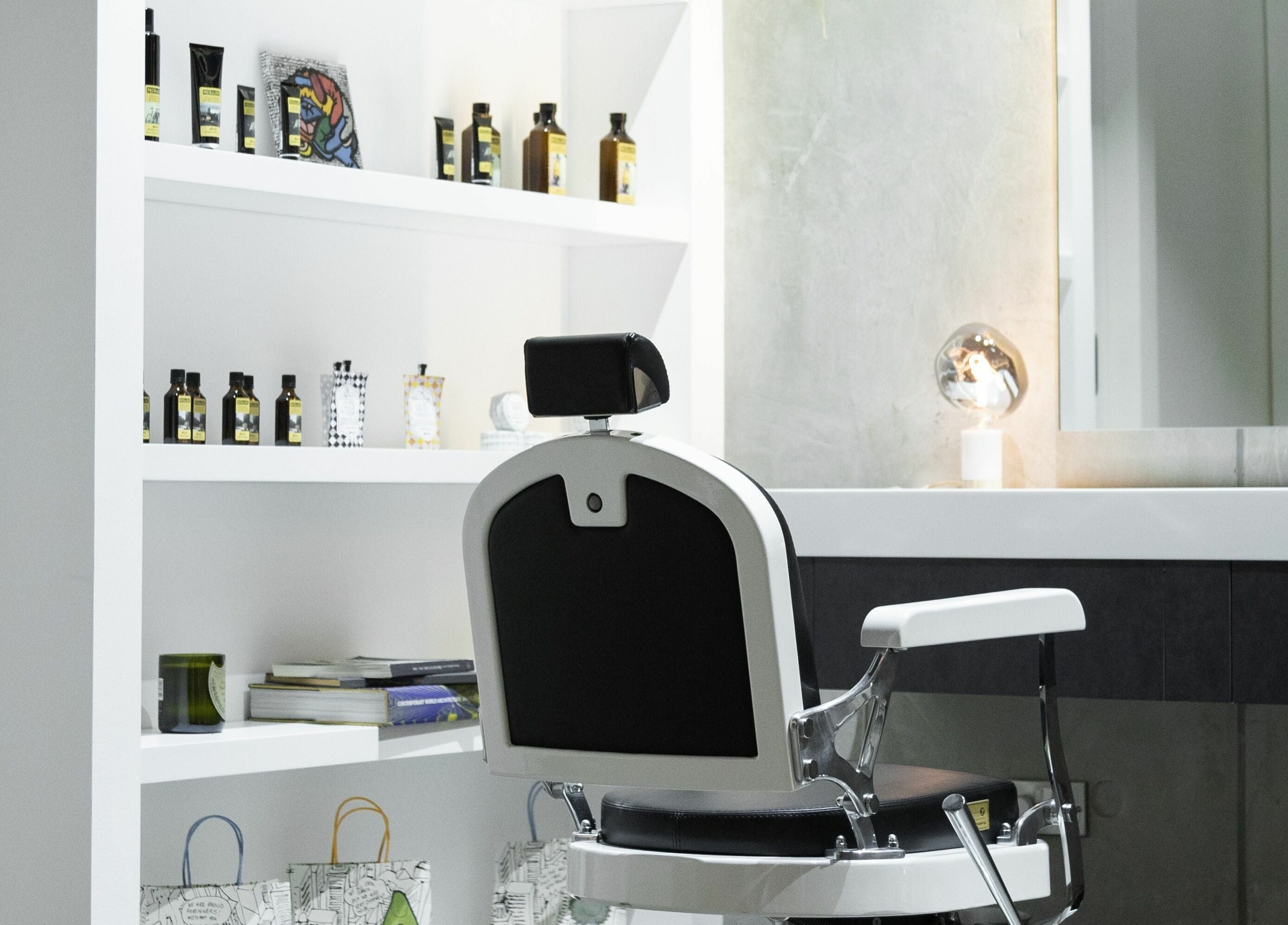 Luxurious barber chair at 011 Italian Grooming DIFC, Dubai, Dubai, AE, with products on display.