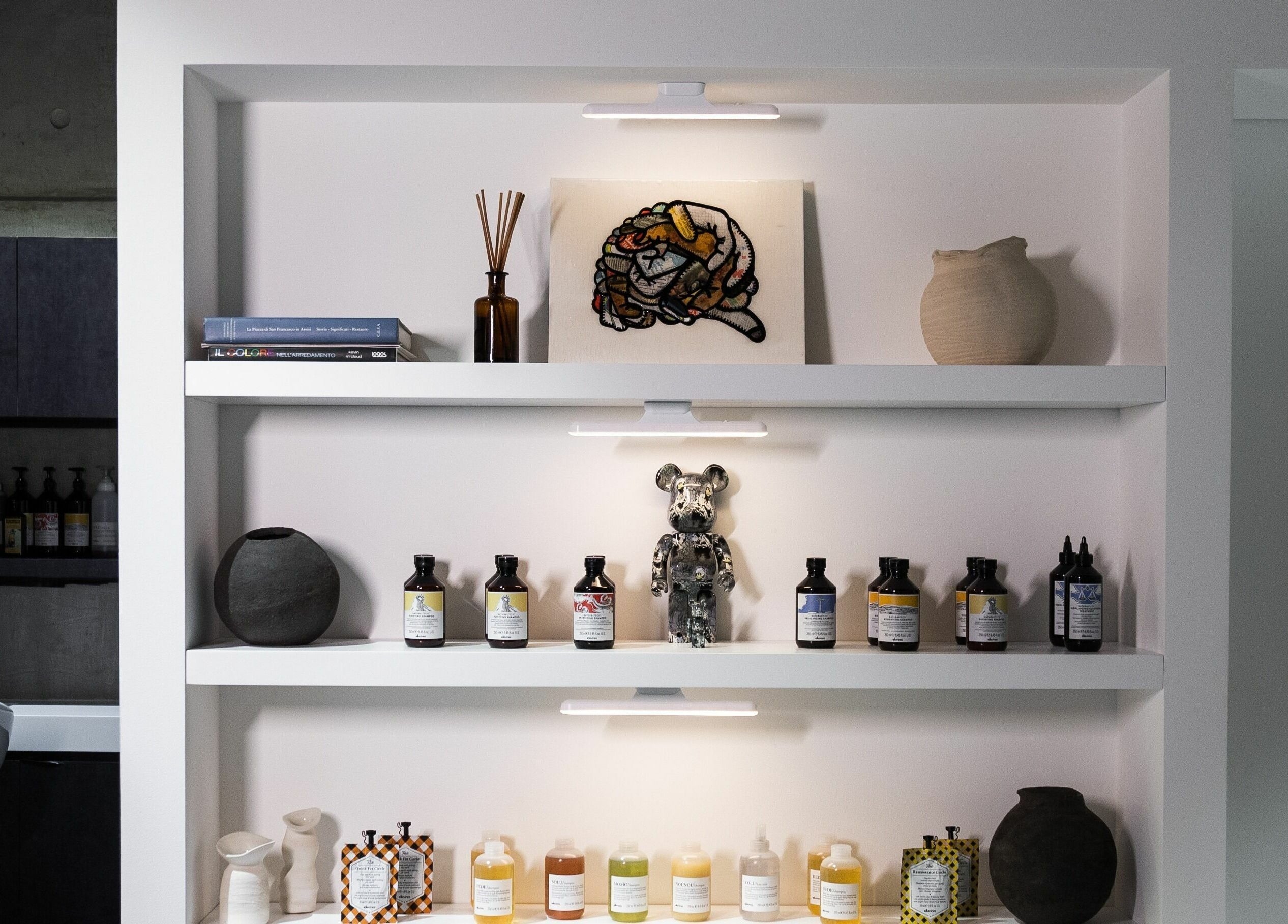 Stylish grooming shelves at 011 Italian Grooming DIFC, Dubai, Dubai, AE with products and decor.